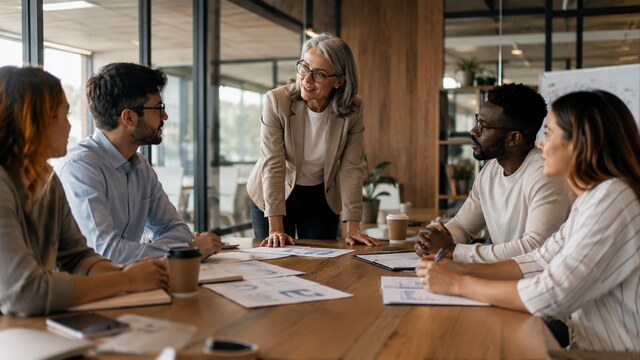 Professional team collaborating in a modern office meeting
